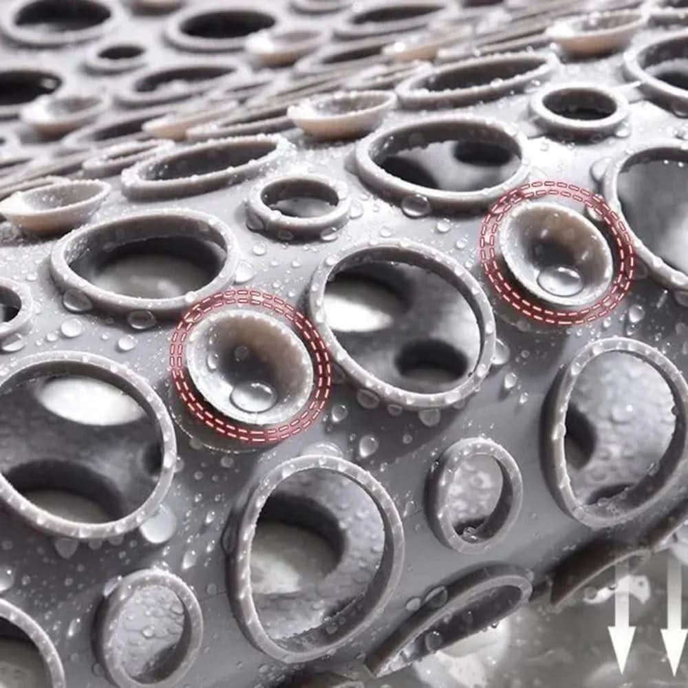 Close-up of a textured surface with circular patterns and water droplets.