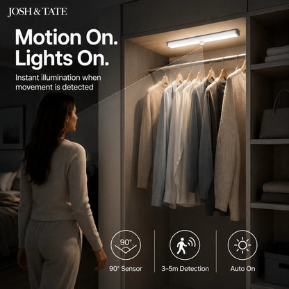 Josh & Tate - MagBar™ Motion-Sensing LED Light - Woman standing in a closet with motion-activated lighting, featuring Josh & Tate product branding.