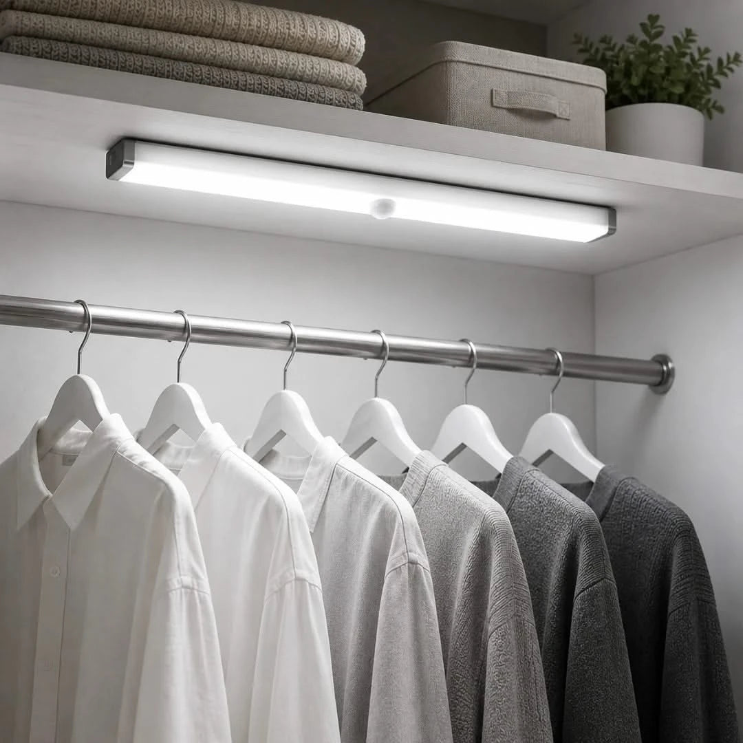 Josh & Tate - MagBar™ Motion-Sensing LED Light - Closet with clothes on hangers under a light fixture