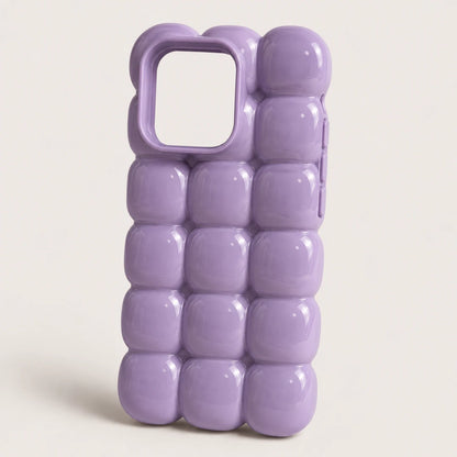 Josh & Tate - MarshBubble™ Puffy iPhone Case - A lavender purple phone case with a glossy, bubble-textured design, shown on a light beige background.