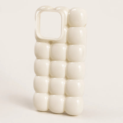 Josh & Tate - MarshBubble™ Puffy iPhone Case - An off-white phone case with a 3D bubbled, bubblegum-like textured design, shown on a clean, light beige background.
