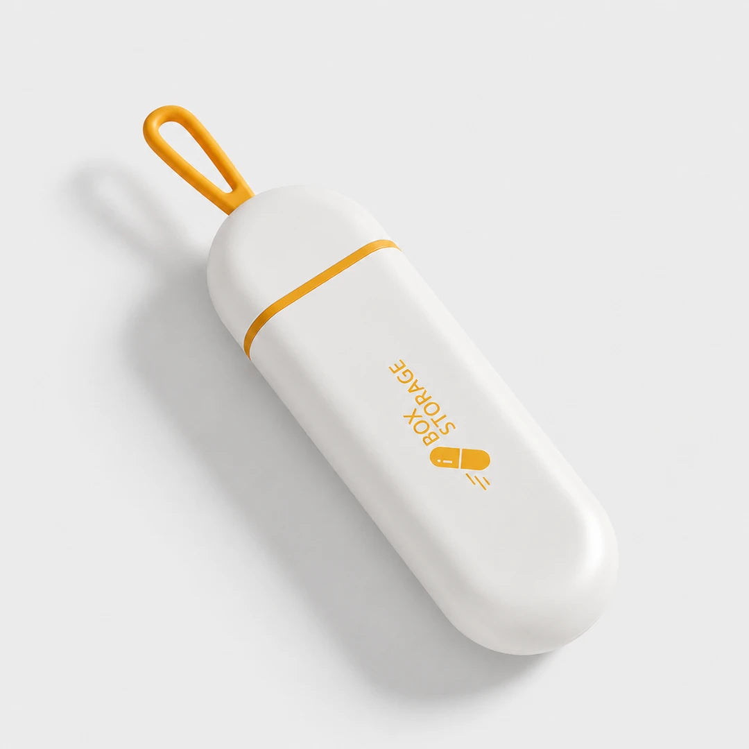 Josh & Tate - MedicineStorage™ Portable Pill Organizer - A white pill-shaped portable storage box with a bright yellow-orange loop handle and matching accent line, featuring the text 'BOX STORAGE' and a capsule icon on a light gray background.