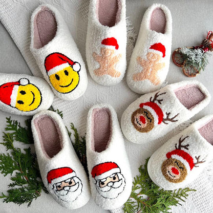 Set of white slippers with festive designs on a light background