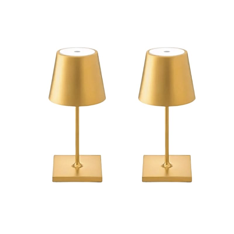 Two gold table lamps on a white background