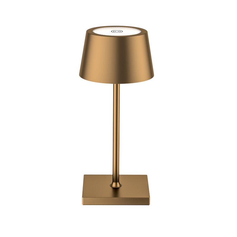 Gold table lamp on a white background
