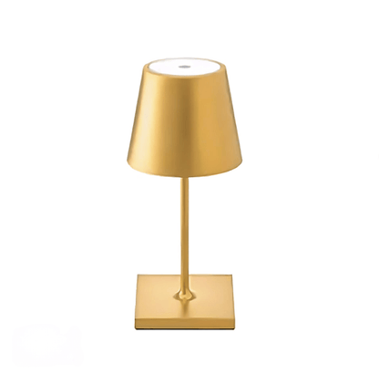 Gold table lamp on a white background