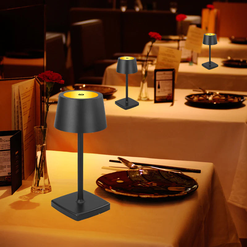 Black table lamps on restaurant tables with dim lighting