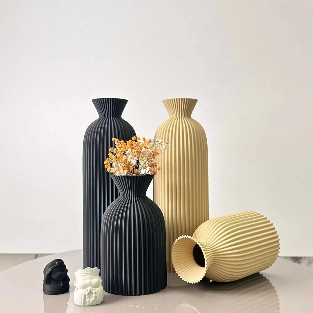 Josh & Tate - Minimalist Fluted Ceramic Vase Set - Set of black and beige vases on a light surface with a white background