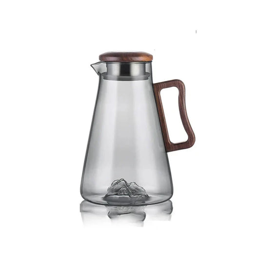 Josh & Tate - Montara Elegant Glass Pitcher - Clear glass pitcher with wooden lid and handle on a white background