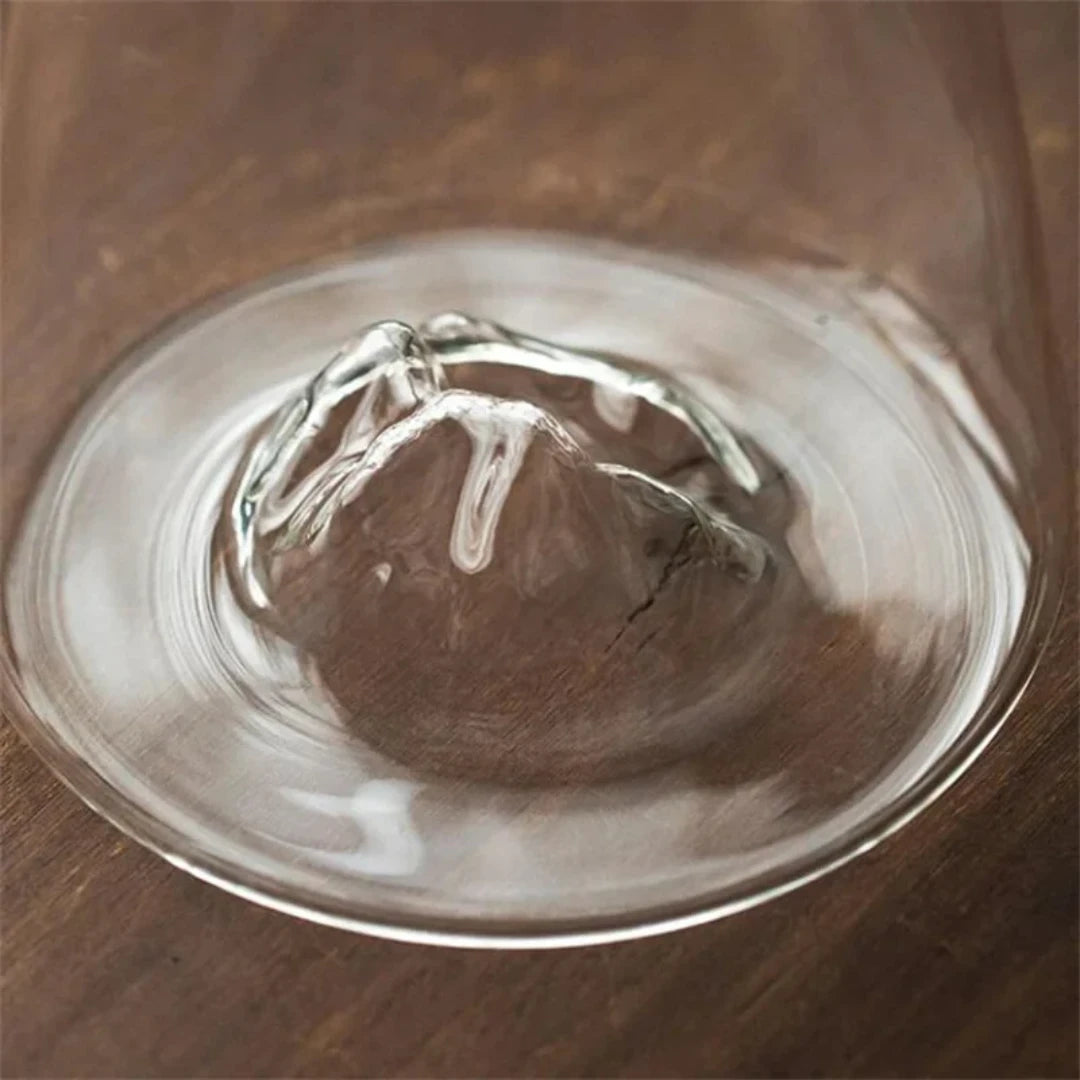 Josh & Tate - Montara Elegant Glass Pitcher - Clear glass bowl with a wooden interior on a wooden surface