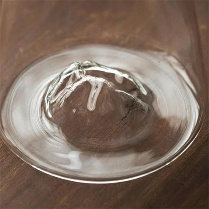 Josh & Tate - Montara Elegant Glass Pitcher - Clear glass bowl with a wooden interior on a wooden surface