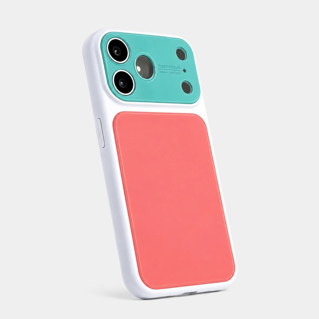 Josh & Tate - MoodBlock™ iPhone Case - A protective phone case with a dual-tone design, featuring a coral pink back panel and a teal camera lens protector, framed by a white bumper, shown on a light gray background.