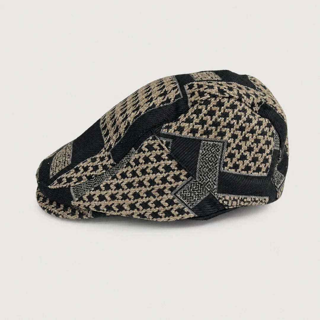 Josh & Tate - MosaicBrim™ Patchwork Flat Cap - A structured flat cap with a woven houndstooth pattern in black and beige, photographed on a neutral light gray background.