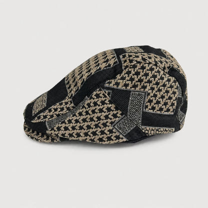 Josh & Tate - MosaicBrim™ Patchwork Flat Cap - A structured flat cap with a woven houndstooth pattern in black and beige, photographed on a neutral light gray background.