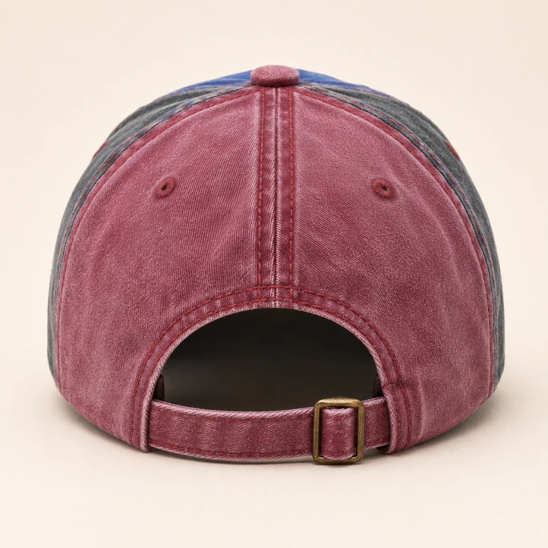 Josh & Tate - NewYork79™ Vintage Cap - A washed denim baseball cap shown from the back, featuring a dusty rose denim crown, gray denim side panels, a blue top panel, and an adjustable back strap with a brass-tone buckle.