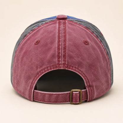 Josh & Tate - NewYork79™ Vintage Cap - A washed denim baseball cap shown from the back, featuring a dusty rose denim crown, gray denim side panels, a blue top panel, and an adjustable back strap with a brass-tone buckle.
