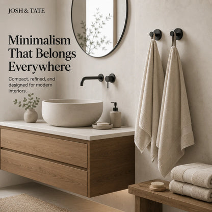 Josh & Tate - NordHook™ Scandinavian Wall Hook Set - Bathroom interior with wooden vanity, round mirror, and towels, featuring Josh & Tate branding.