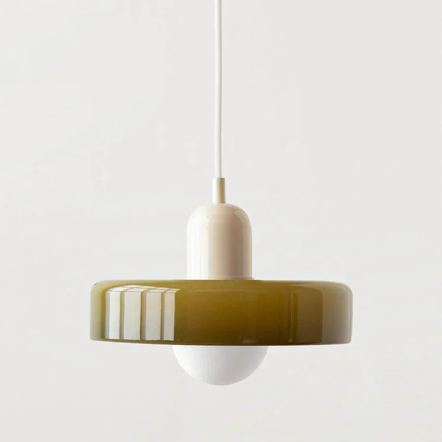 Pendant light with a green and white design on a plain background