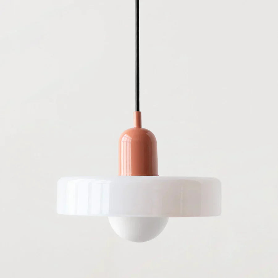 Pendant light with a white shade and pinkish-brown fixture on a light gray background