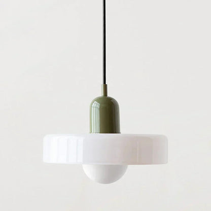 Pendant light with a green ceramic base and white glass shade on a light gray background