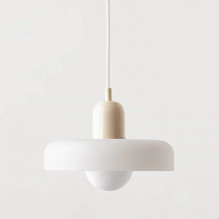 Minimalist pendant light with a white shade and beige fixture on a light gray background