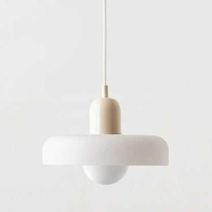 Minimalist pendant light with a white shade and beige fixture on a light gray background
