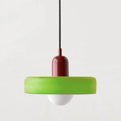 Pendant light with green base and red top on a white background