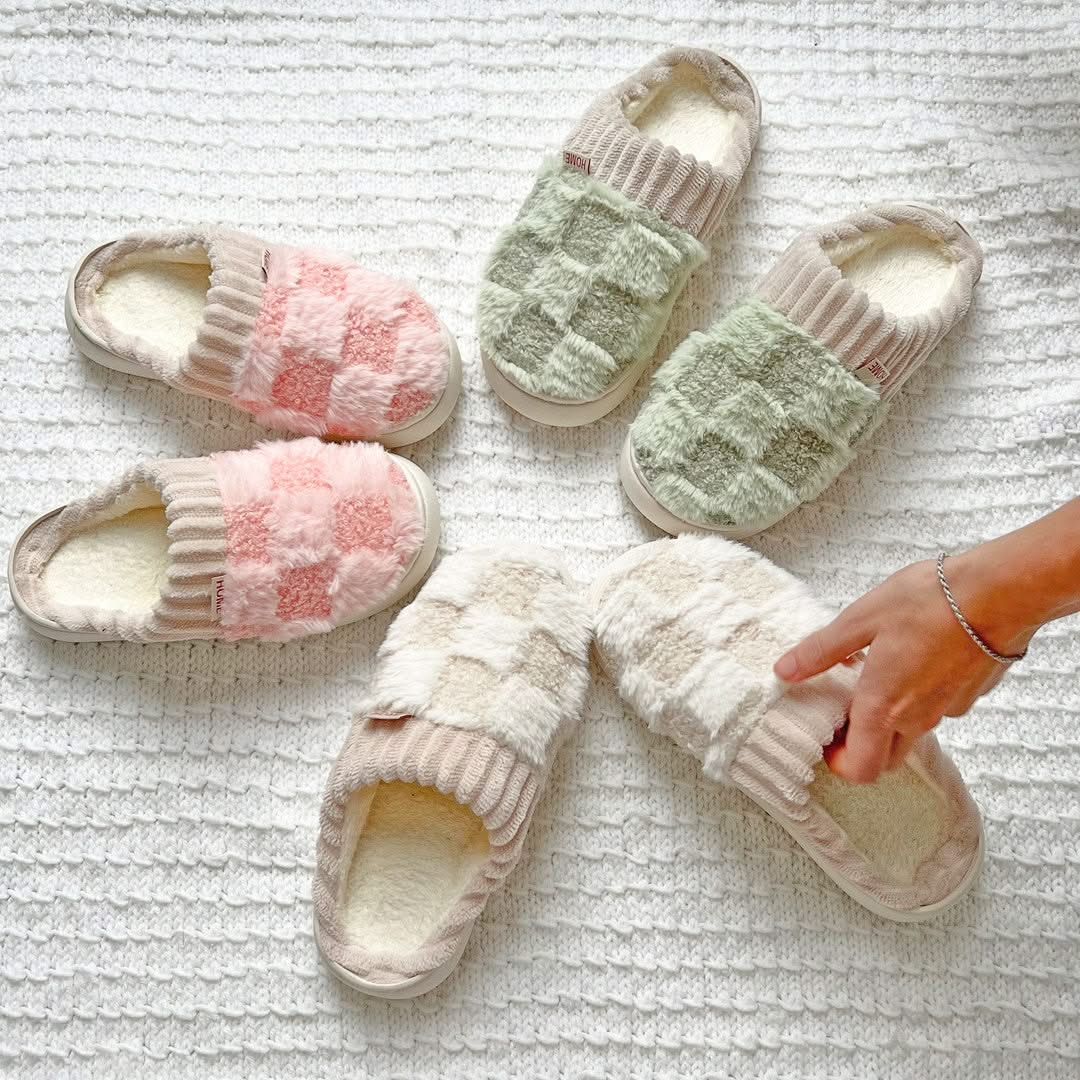 Pair of soft slippers on a textured surface