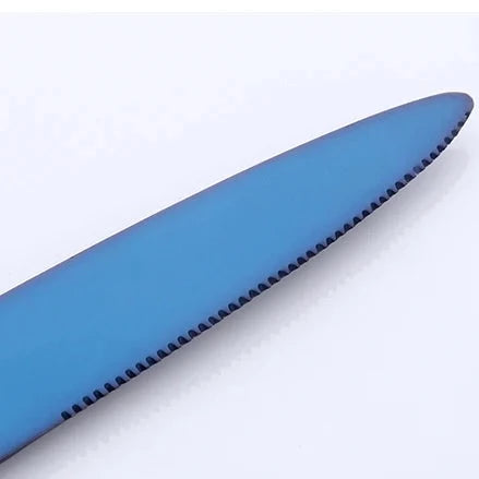 Close-up of a blue knife blade on a white background