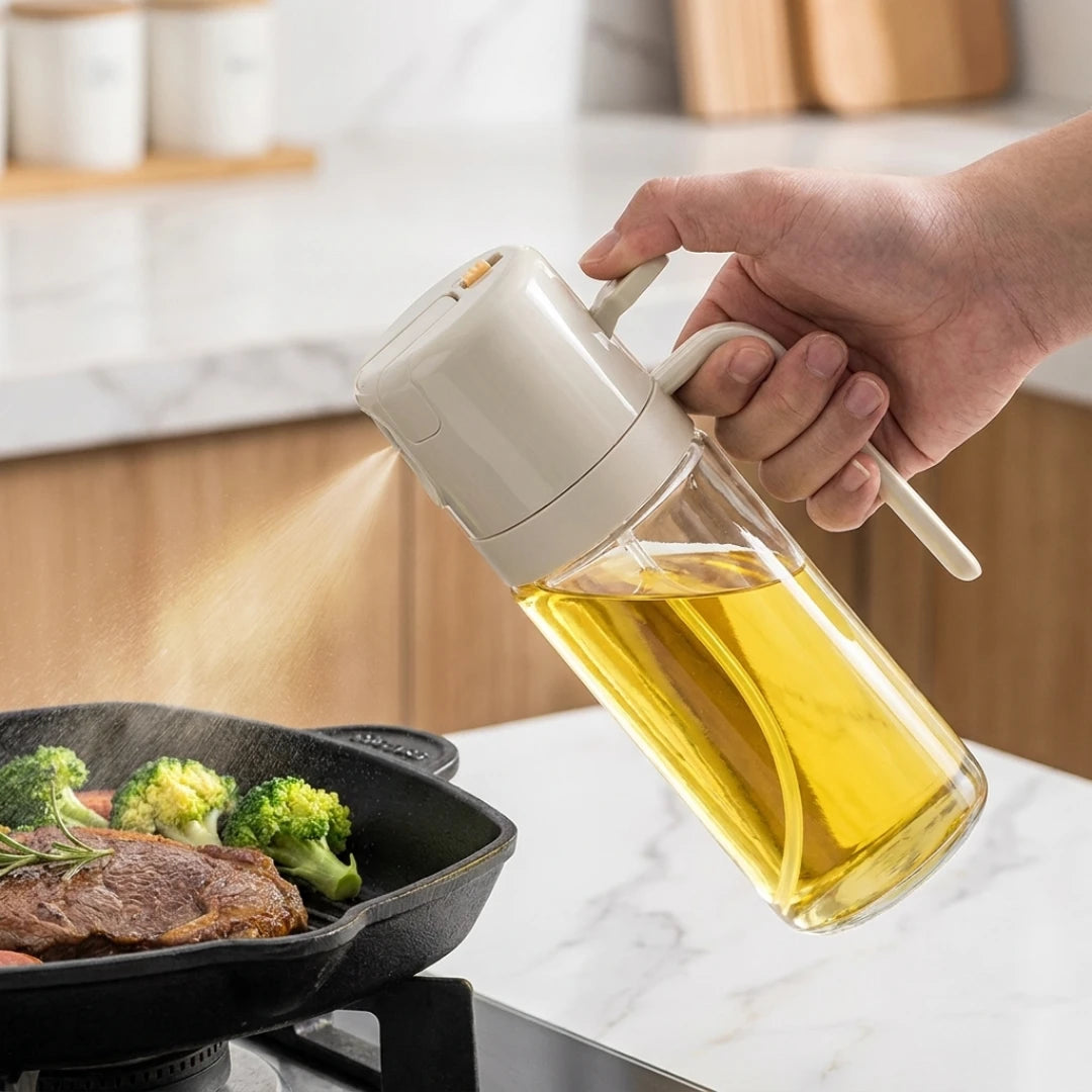 Josh & Tate - OilSwitch™ 2-in-1 Oil Dispenser - Hand pouring oil from a glass bottle into a pan with food on a kitchen counter.