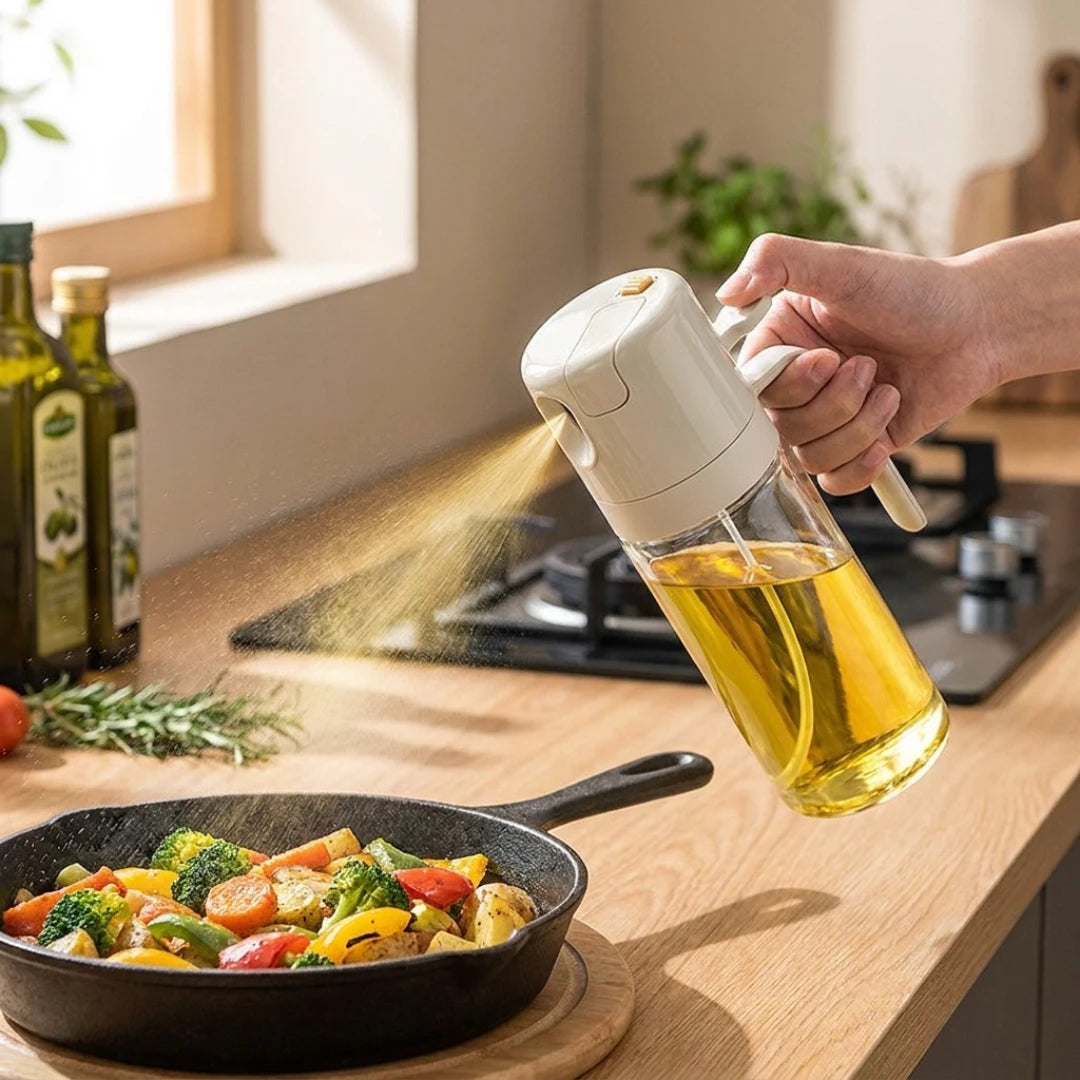 Josh & Tate - OilSwitch™ 2-in-1 Oil Dispenser - Person pouring oil from a bottle into a frying pan with vegetables on a kitchen counter.