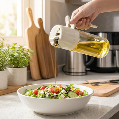 Josh & Tate - OilSwitch™ 2-in-1 Oil Dispenser - Person pouring olive oil from a bottle onto a salad in a kitchen.