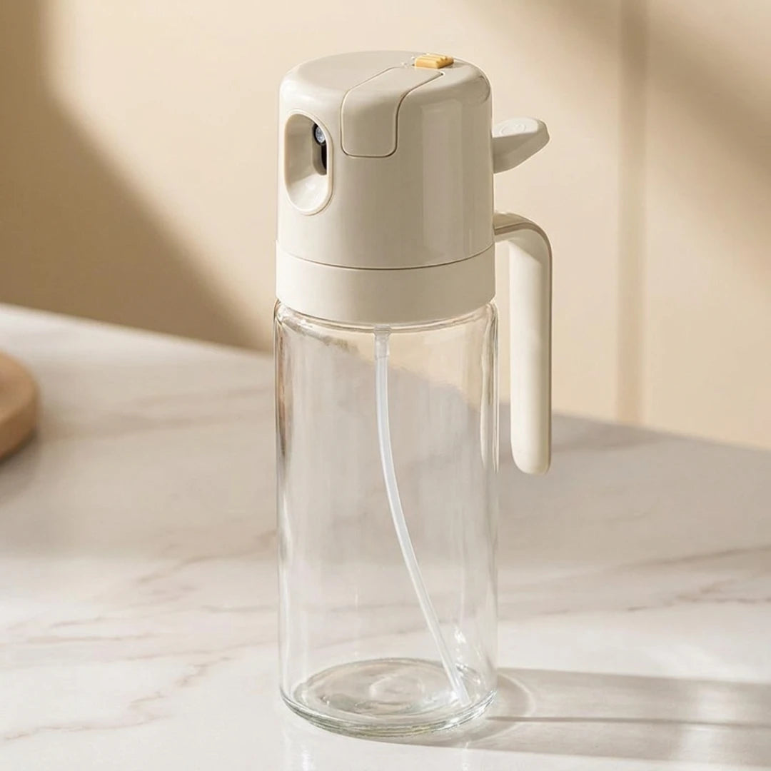 Josh & Tate - OilSwitch™ 2-in-1 Oil Dispenser - Clear glass water bottle with a beige cap on a light surface