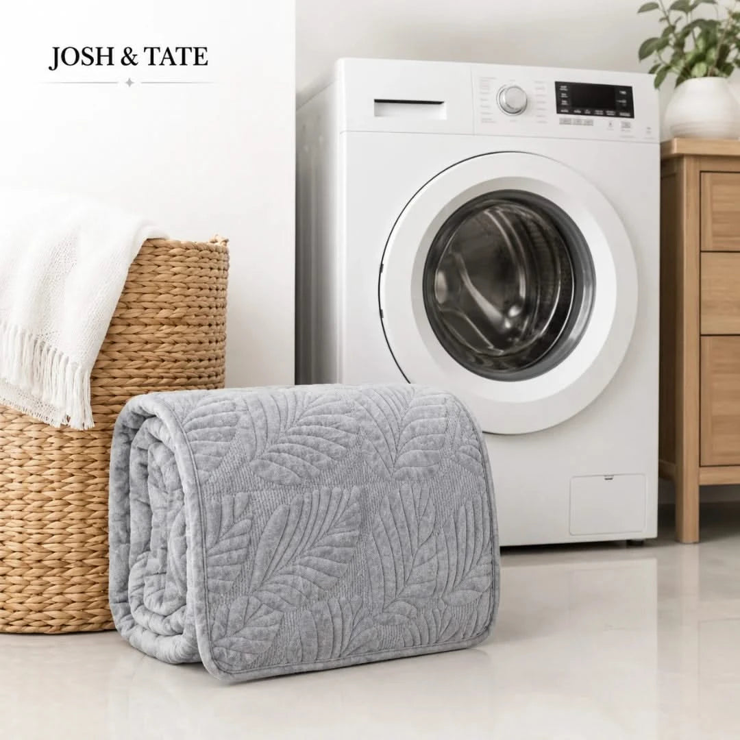 Josh & Tate - PalmSoft™ Quilted Chair Cover - Gray quilted blanket in front of a washing machine with 'Josh & Tate' branding.