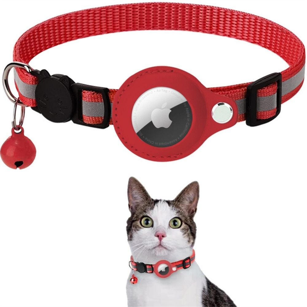 Red pet collar with a bell and reflective strip, worn by a cat on a white background