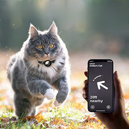 Cat running outdoors with a smartphone displaying a pet tracking app.
