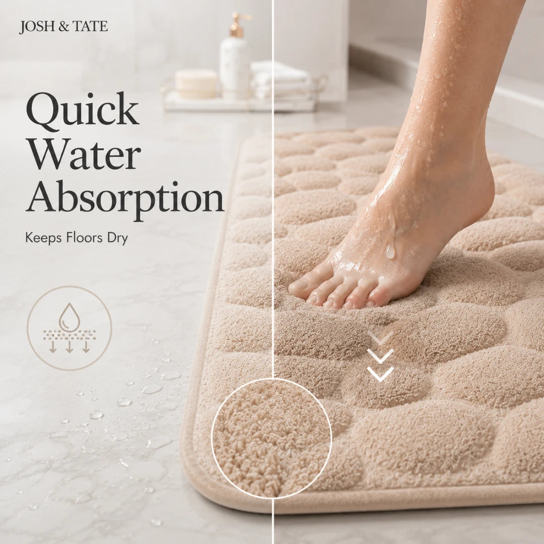 Josh & Tate - PebbleSoft™ Non-Slip Memory Foam Mat - Beige bath mat with text 'Quick Water Absorption' and 'JOSH & TATE' branding, showing water absorption properties.