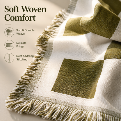 Josh & Tate - PicnicCo™ Woven Outdoor Blanket - Green and white woven blanket with fringe details on a neutral background