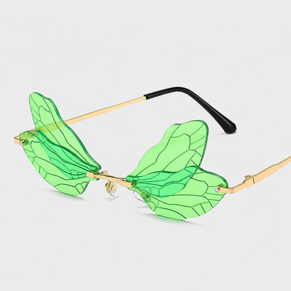 Josh & Tate - PixieFrame™ Butterfly Sunglasses - Green leaf-shaped rimless sunglasses with gold metal temples and black earpieces, displayed on a light gray background.