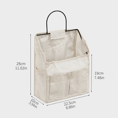 Josh & Tate - PocketPerch™ Hanging Organizer - A beige fabric hanging organizer bag with a black metal handle, shown with overlaid dimension lines and measurements for height, width, and depth on a light gray background.