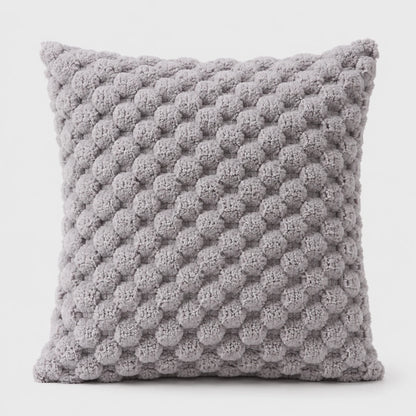 Josh & Tate - PuffKnot™ Bobble Cushion Cover - A square throw pillow in a textured, chunky knit fabric with a light gray and white honeycomb pattern, shown against a plain white background.