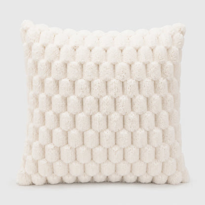 Josh & Tate - PuffKnot™ Bobble Cushion Cover - A square throw pillow in a warm off-white or cream bouclé fabric, featuring a raised honeycomb or bumpy textured pattern, shown against a light gray studio background.