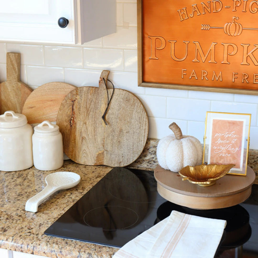 Josh & Tate - Pumpkin Wooden Cutting Board - Decorative kitchen scene with pumpkins, cutting boards, and a 'Hand-Picked Pumpkin Farm Fresh' sign.