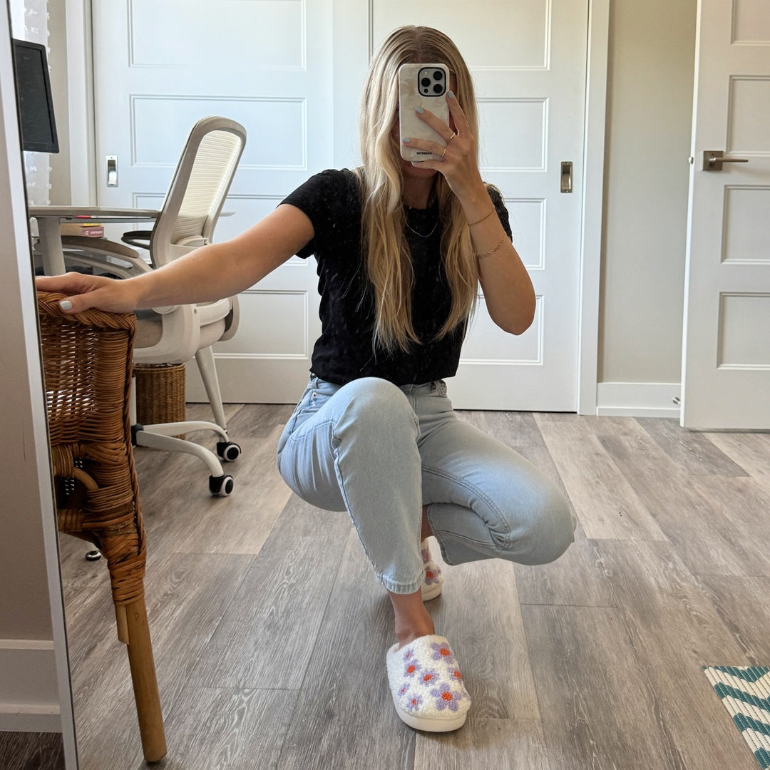 Person taking a mirror selfie in a home office setting