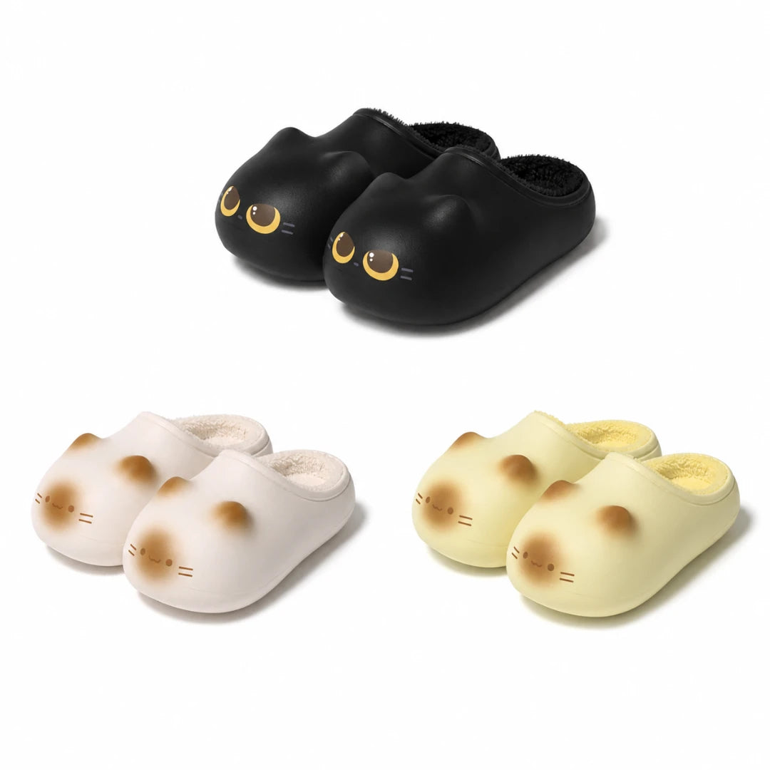 Josh & Tate - PurrPad™ Cozy Cat-Face Slippers - Three pairs of slip-on mule slippers shaped like cat faces, shown on a clean white background: one black pair, one off-white pair, and one pale yellow pair. Each slipper has embroidered cat-eye and nose details.