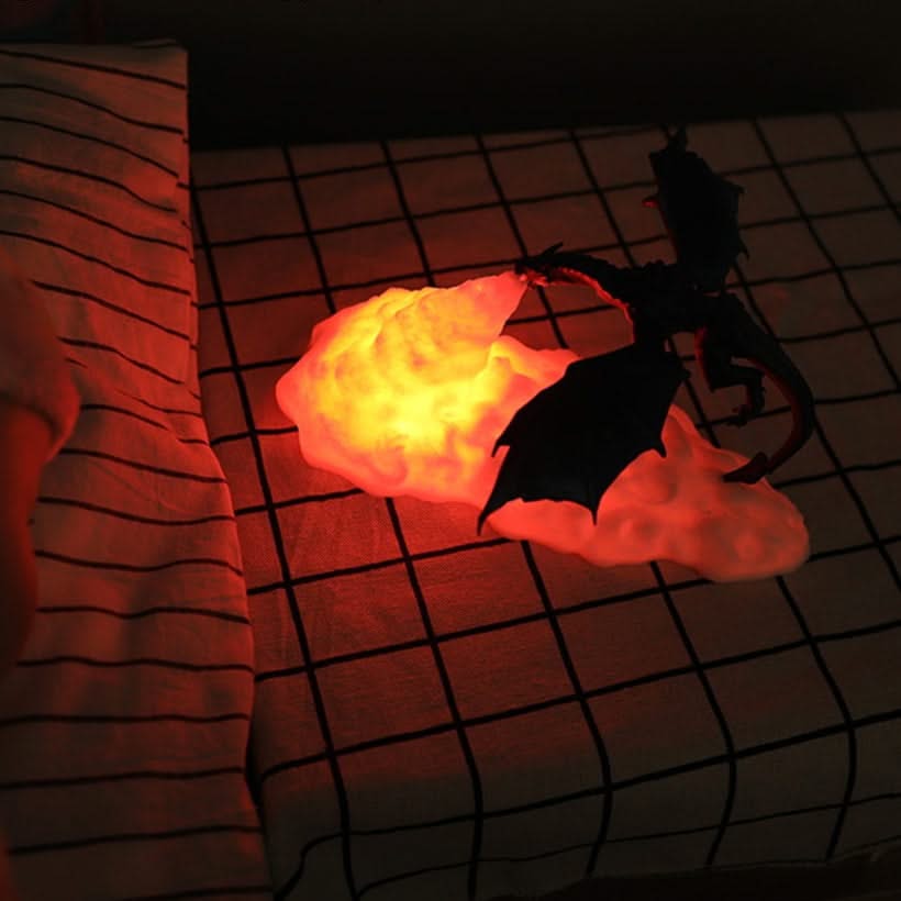 Toy dragon with glowing red chest on a grid surface