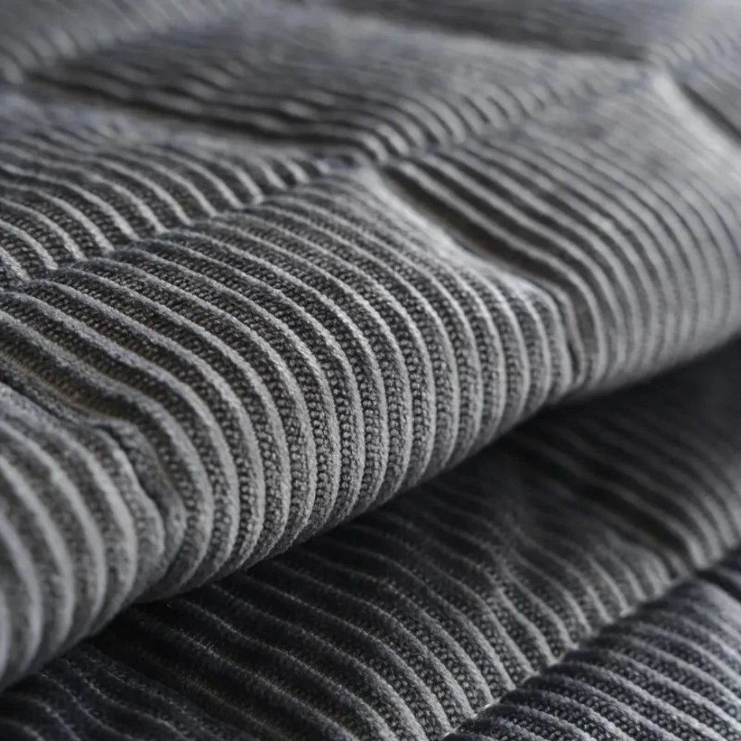 Josh & Tate - QuiltDrape™ Corduroy Sofa Cover - Close-up of gray ribbed fabric texture