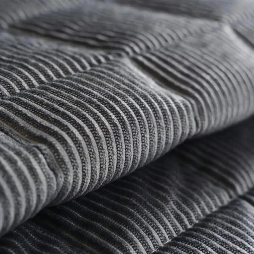 Josh & Tate - QuiltDrape™ Corduroy Sofa Cover - Close-up of gray ribbed fabric texture