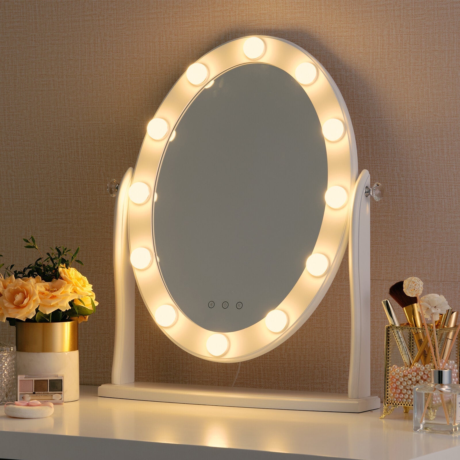 Lighted vanity mirror on a desk with decorative items