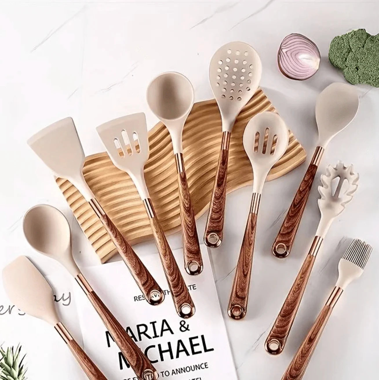 Set of wooden kitchen utensils on a table with a magazine underneath